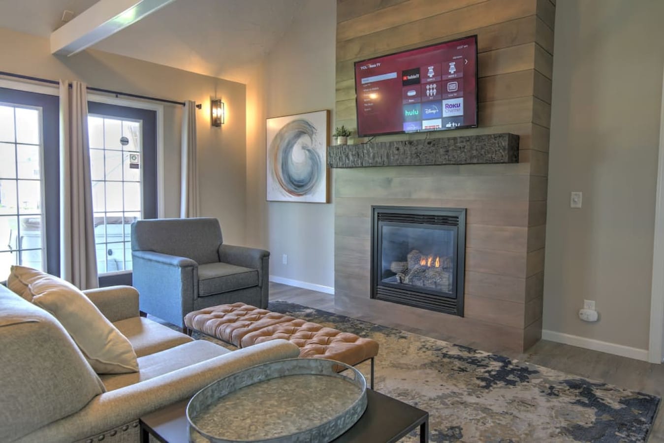 Modern living room with fireplace inside Premier Cottage #11, Berlin Ohio