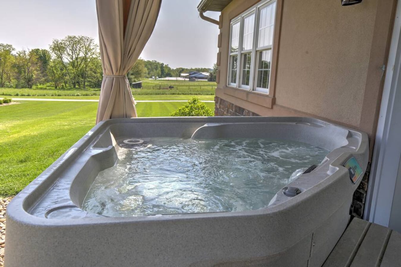 A private hot tub with open country views at Premier Cottages in Berlin, Ohio