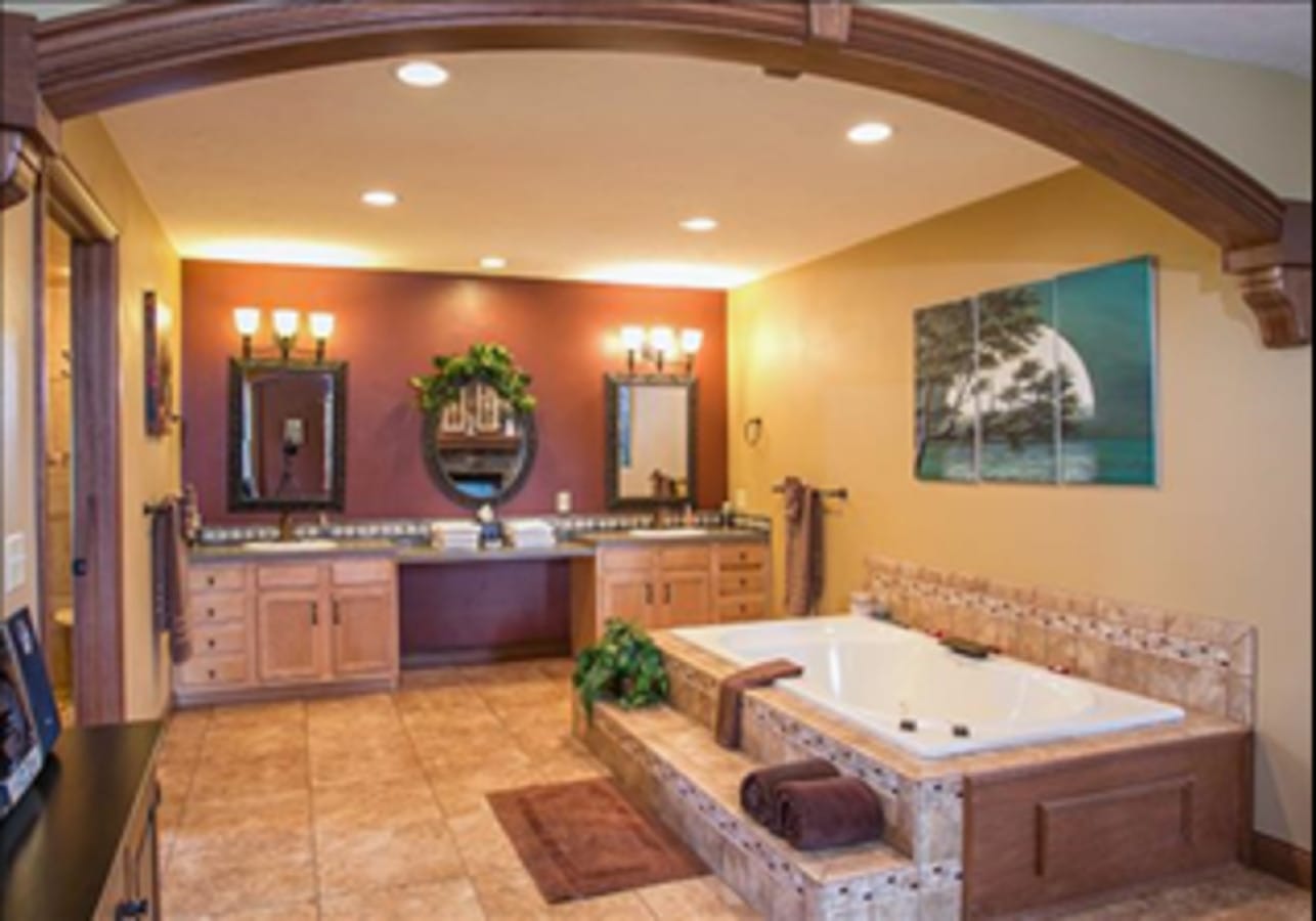 Indoor two-person jacuzzi tub inside Premier Cottage #7 at Premier Cottages, Berlin Ohio
